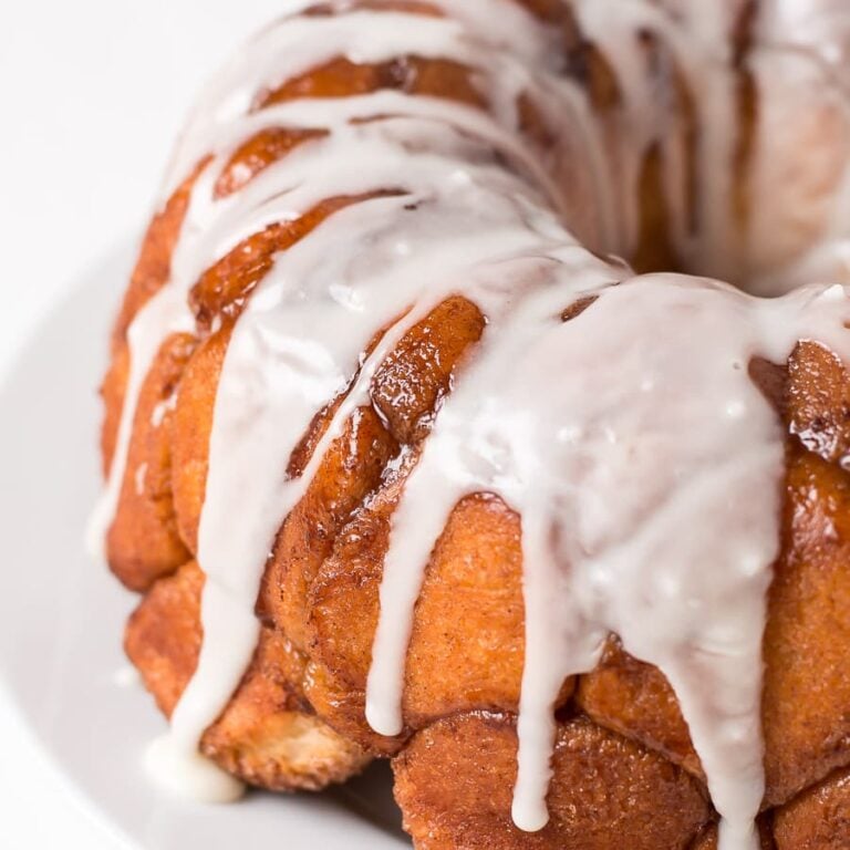 Buttery, cinnamon and sugar coated balls of dough, covered in a sweet creamy glaze... this Monkey Bread is irresistible!