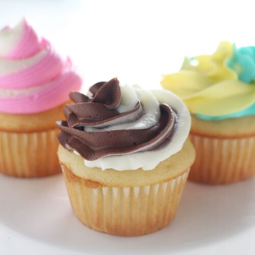 Learn my 3 ways to make two-toned (or even three!) swirled cupcake frosting. The second method doesn't even require a piping bag OR decorative piping tip. Click for my full step-by-step video, product recommendations, and more!