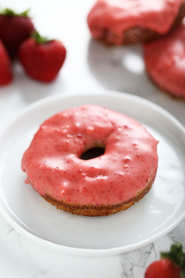 Lightened up with Greek yogurt, these fresh Strawberry Baked Donuts feature an ultra thick pink strawberry glaze and come together in just 35 minutes! No artificial flavors. 
