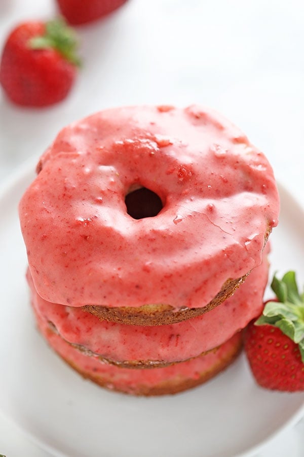 Lightened up with Greek yogurt, these fresh Strawberry Baked Donuts feature an ultra thick pink strawberry glaze and come together in just 35 minutes! No artificial flavors. 