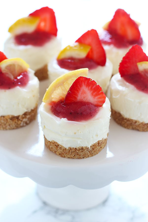 Fruity, tart, and ADORABLE, these No Bake Strawberry Lemonade Mini Cheesecakes are the perfect summer treat!