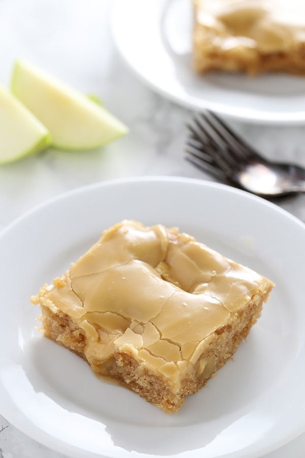 Salted Caramel Apple Sheet Cake features an ultra tender, slightly spongey cinnamon apple cake with a thick and shiny salted caramel glaze. Perfect for serving a crowd during the holidays!