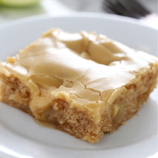a slice of salted caramel apple sheet cake on a plate