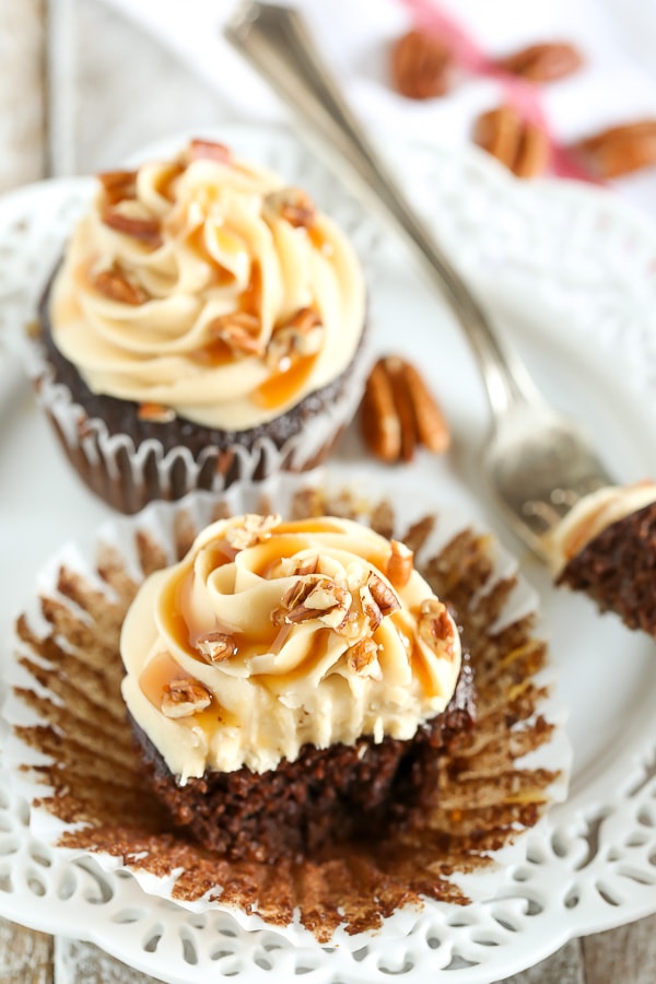 These Chocolate Turtle Cupcakes feature a soft and light chocolate cupcake, a rich caramel frosting, and are topped with caramel sauce and chopped pecans.