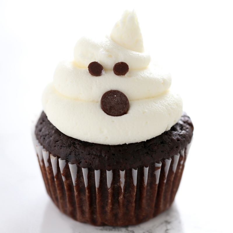 a cupcake with buttercream piped to resemble a ghost