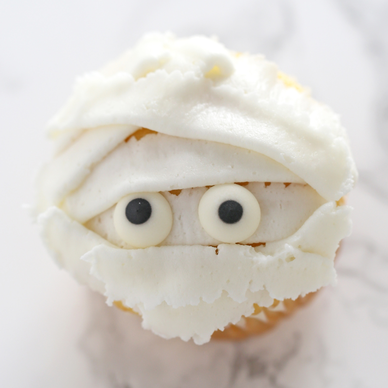 halloween cupcake frosted to look like a mummy