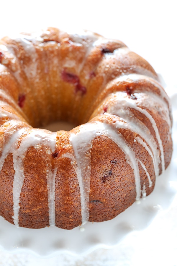 This Cranberry Orange Bundt cake features a soft and delicious cake with hints of orange and juicy cranberries in every bite!