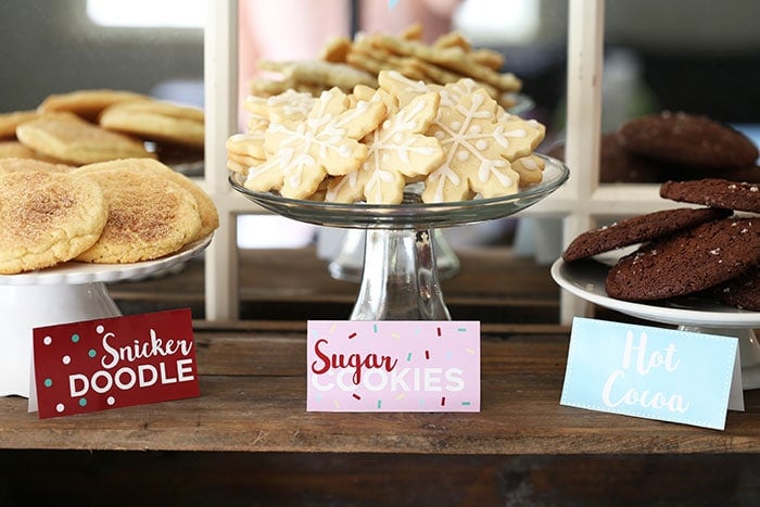 three plates of cookies: snickerdoodles, sugar cookies, and hot cocoa cookies. 