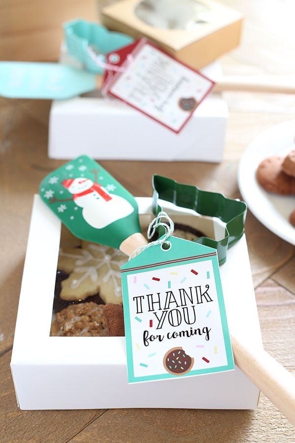 a cute bakery box full of cookies.