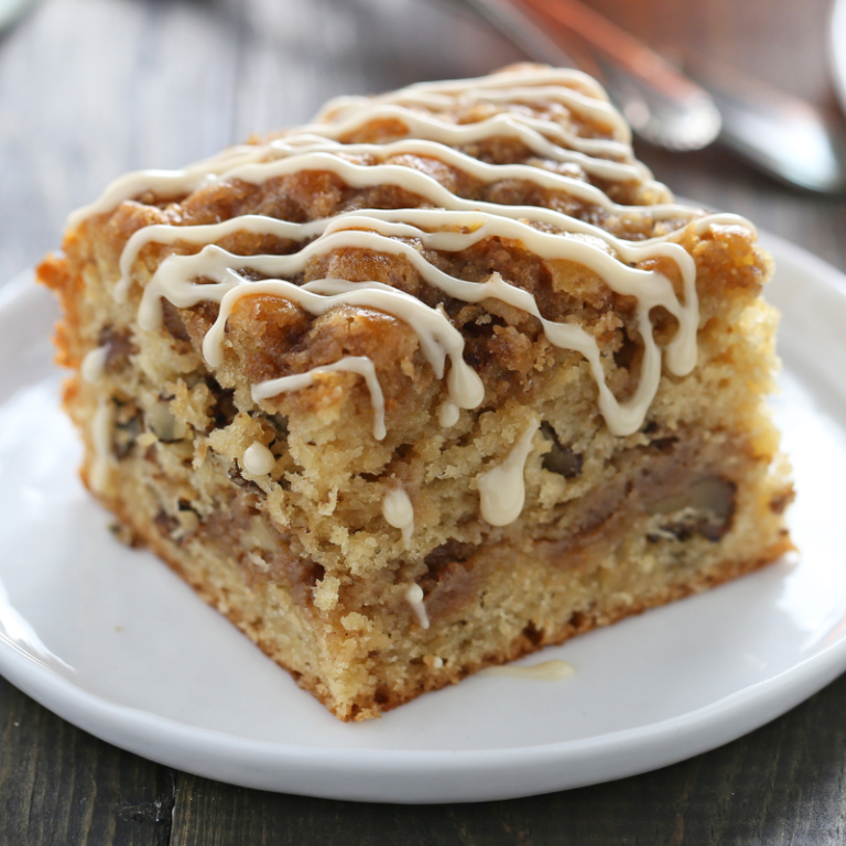 a slice of maple walnut coffee cake on a plate, ready to serve