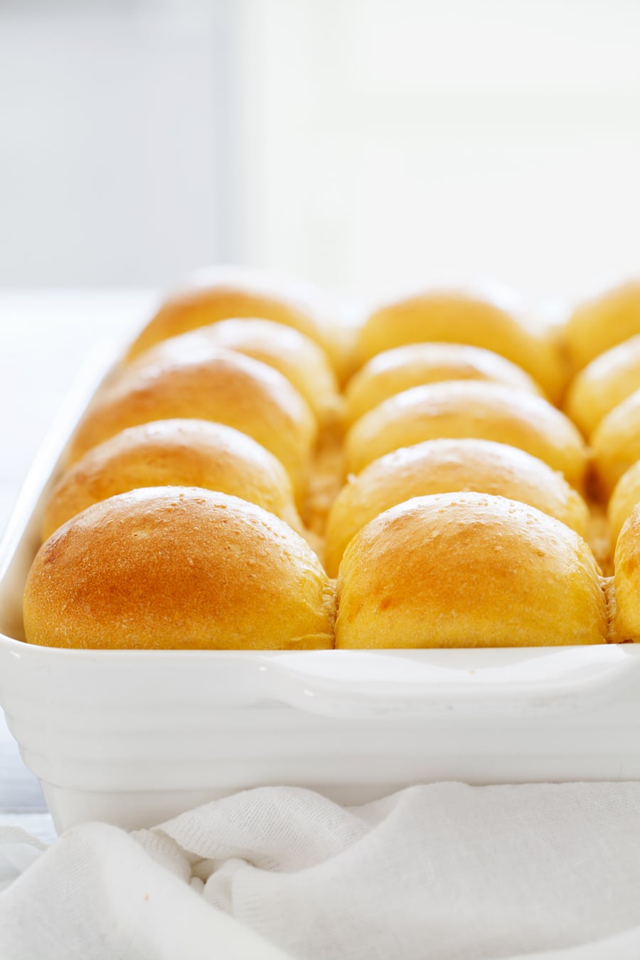 Sweet Potato Dinner Rolls are ridiculously soft and fluffy with a slightly crisp and chewy crust and a hint of fresh sweet potato goodness.