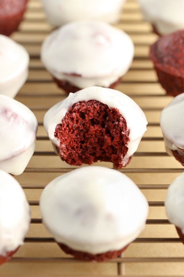 Baked Red Velvet Donut Holes topped with an easy cream cheese glaze and perfect for a sweet breakfast or Valentine's Day!
