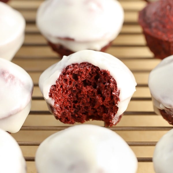 Baked Red Velvet Donut Holes topped with an easy cream cheese glaze and perfect for a sweet breakfast or Valentine's Day!