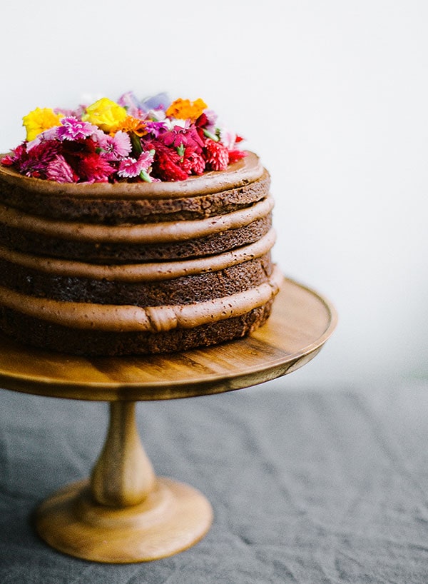 Stunning Nutella Chocolate layer cake, decorated with fresh edible flowers