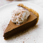 slice of homemade chocolate pudding pie, with whipped cream on top