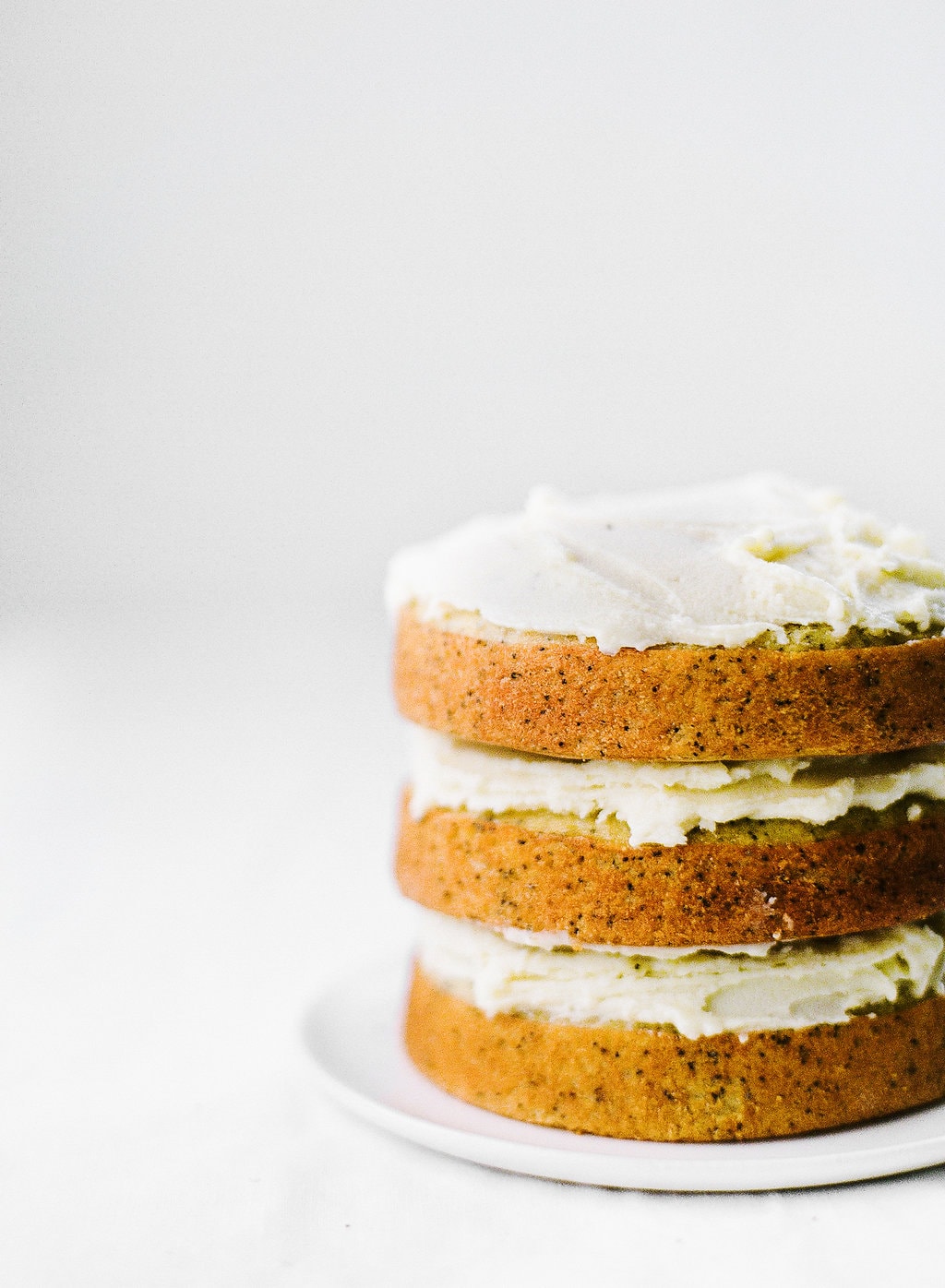 Vanilla Poppy Seed Cake with Whipped Ganache is three layers of ultra moist cake and pure vanilla decadence. No special decorating skills needed!