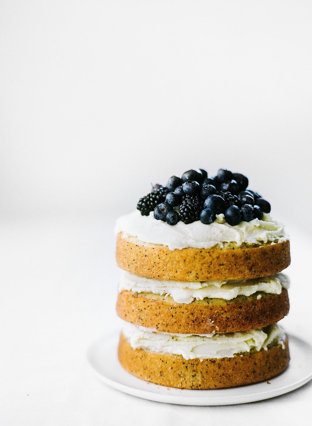 Vanilla Poppy Seed Cake with Whipped Ganache is three layers of ultra moist cake and pure vanilla decadence. No special decorating skills needed!