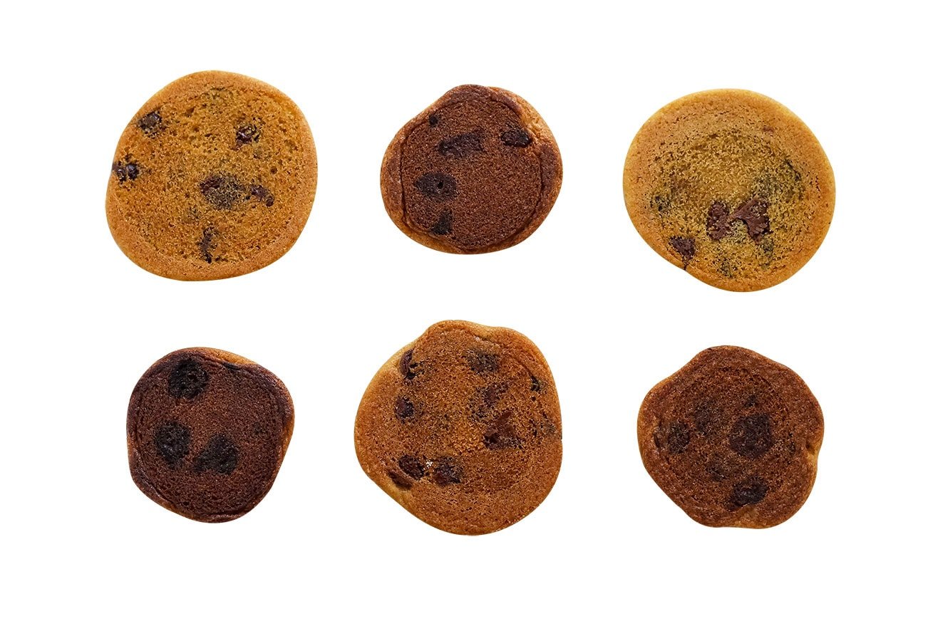 showing the undersides of cookies after testing baking cookies on a variety of baking pans. Some burn the cookies fast!