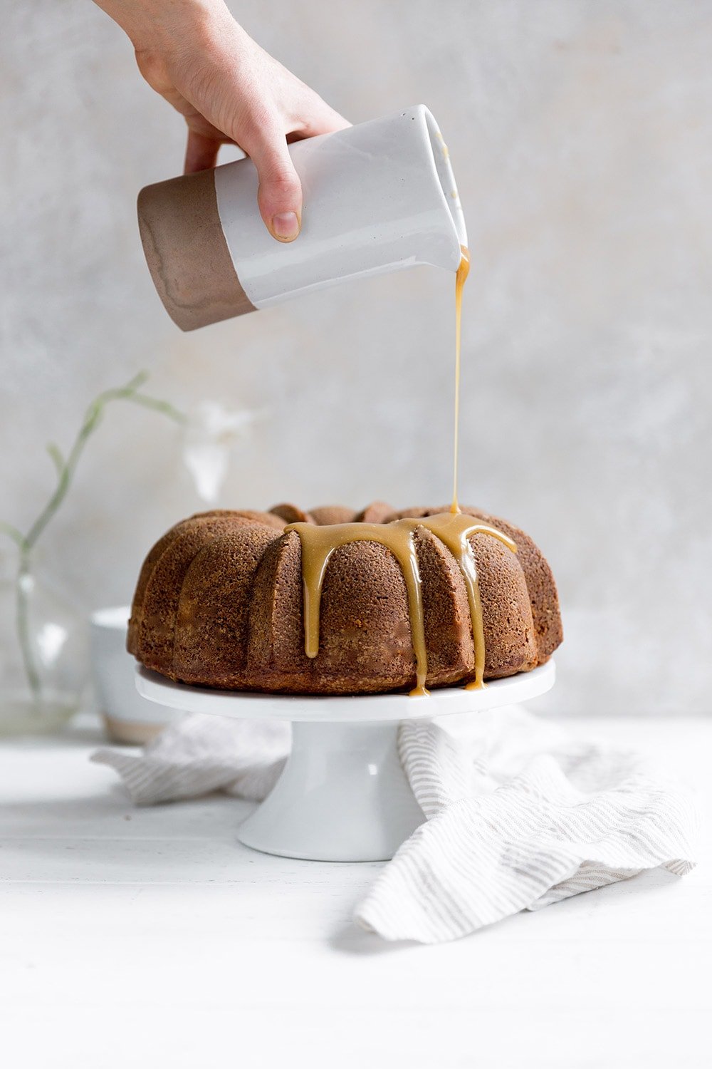 Butterscotch Bundt Cake features a brown sugar sour cream cake drizzled with a thick butterscotch icing for a simple and beautiful fall dessert.