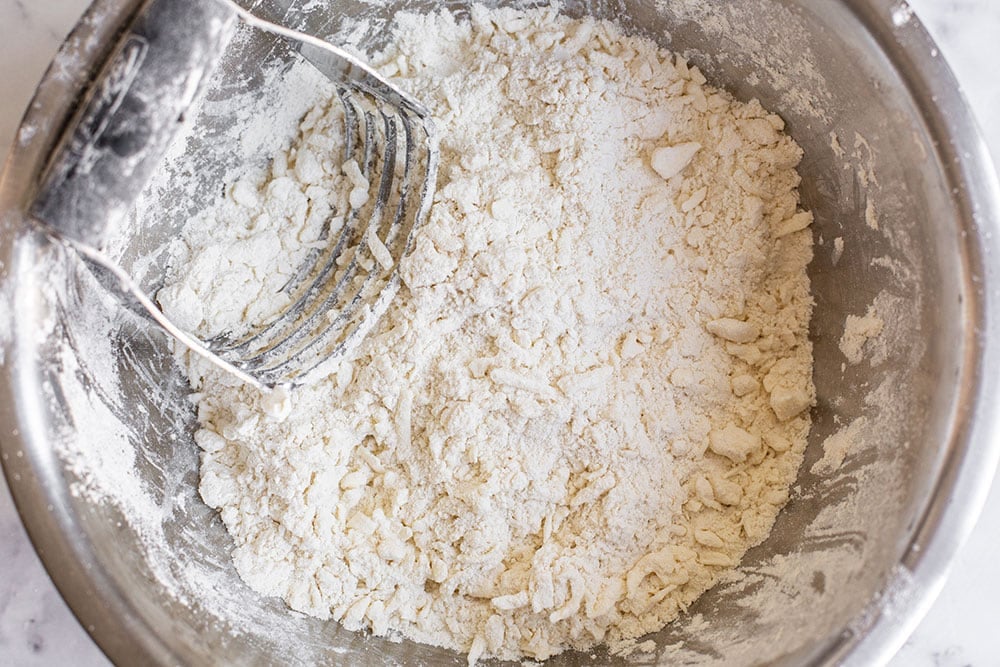 cutting butter into flour for pie dough
