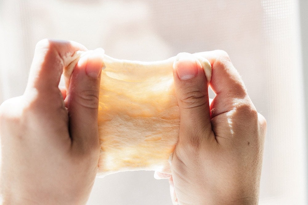 How to Knead Dough by hand without an electric mixer so you can create perfect bread rolls and loaves of bread. Kneading dough correctly is key!