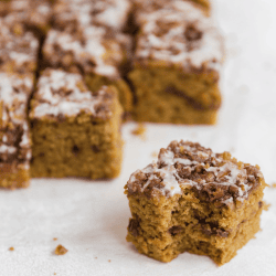 slices of pumpkin spice coffee cake, drizzled with maple icing