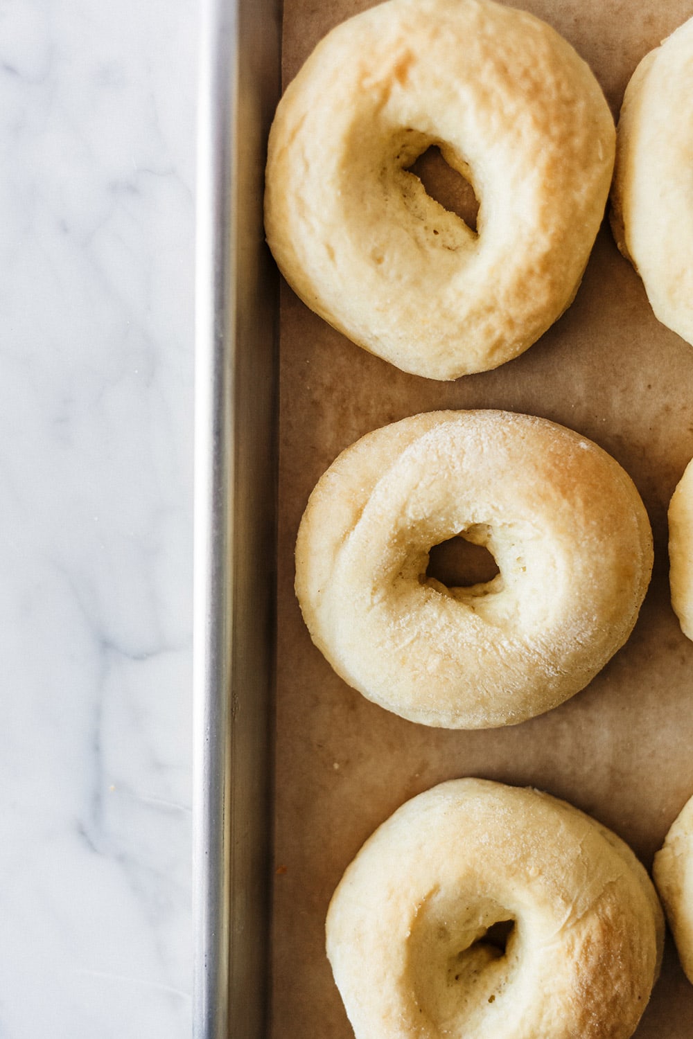 Baked Apple Pie Doughnuts are made with yeast-raised dough that bakes up just as light and fluffy as fried doughnuts but without the mess! Tasty fall treat.