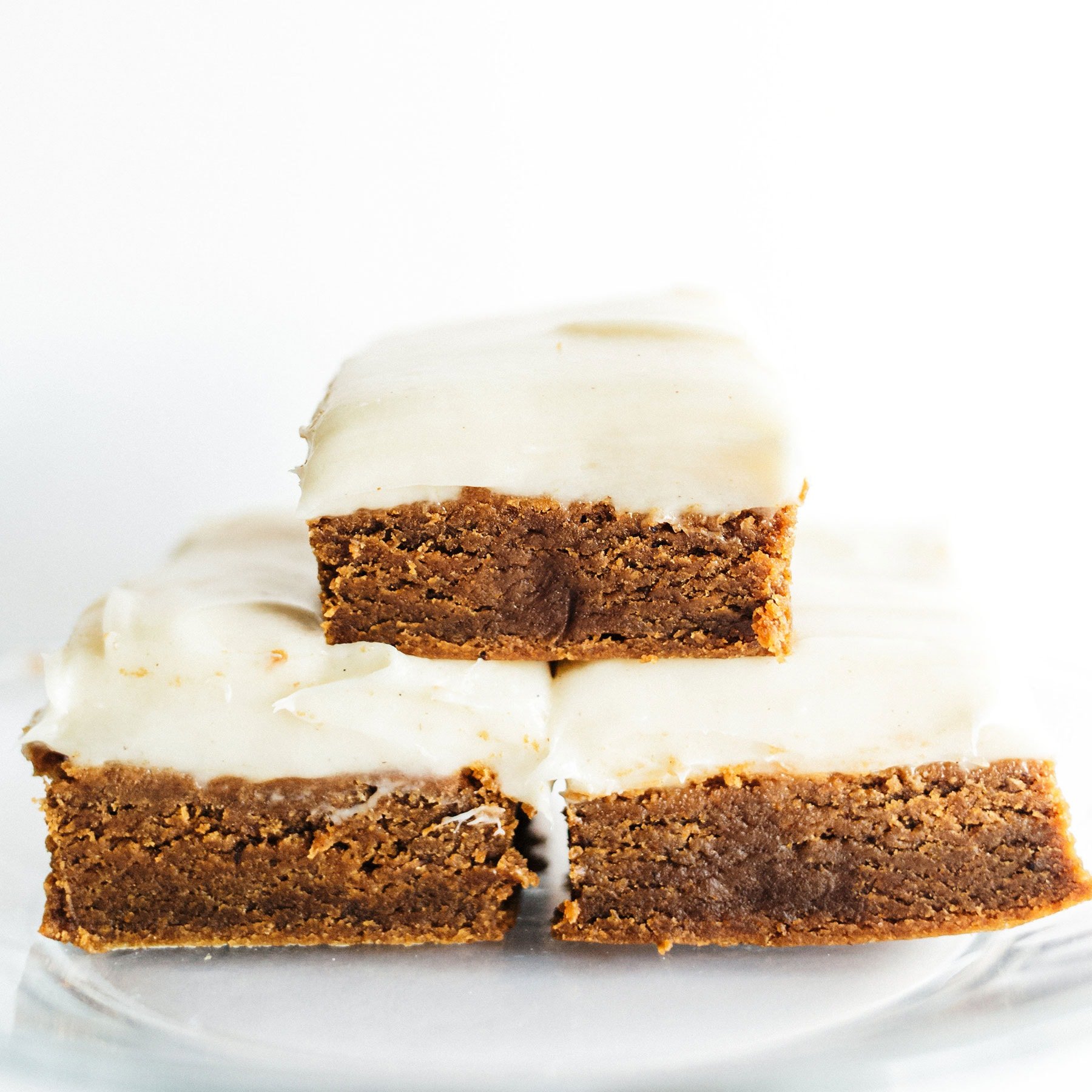 Gingerbread Cookie Bars with Cream Cheese Frosting are ultra thick, soft, and chewy with tons of aromatic spices and a generous layer of tangy frosting!