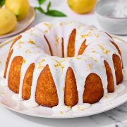 easy and moist lemon bundt cake with lemon glaze and lemon zest drizzled on top