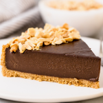 a slice of rich, creamy chocolate peanut butter pudding pie, ready to serve