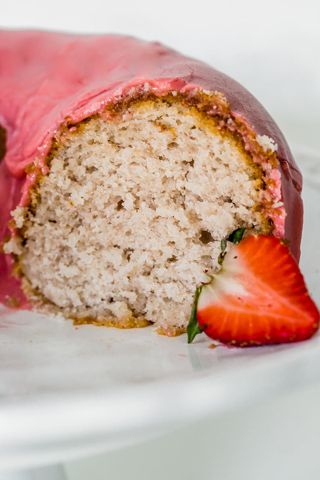 This light, fluffy, and flavorful Strawberry Bundt Cake is made with a fresh strawberry puree and absolutely no artificial colors or flavors! It's the perfect easy yet crowd-pleasing spring or summer cake.