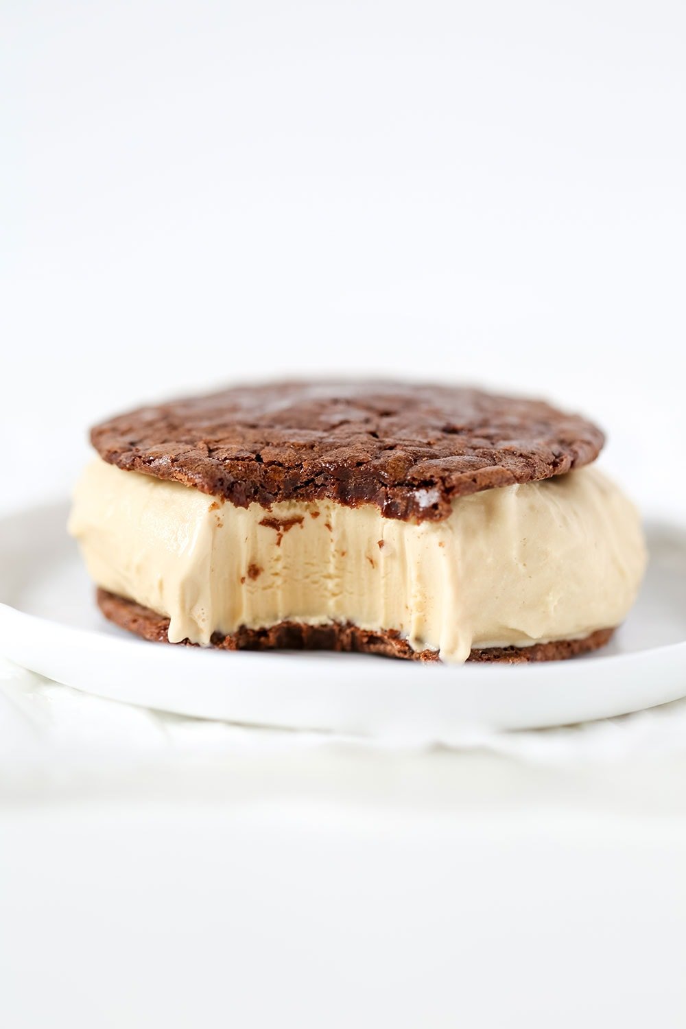 Coffee Brownie Ice Cream Sandwiches feature two layers of thin but ultra rich and fudgy brownie cookies sandwiching a generous layer of creamy cold brew coffee ice cream.