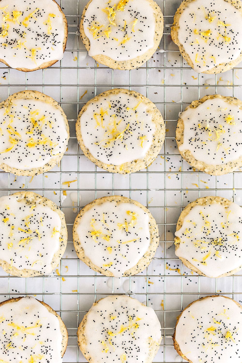 lemon poppy seed cookies cooling on a wire rack.