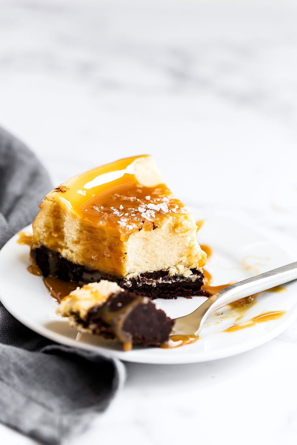 Brownie bottom salted caramel cheesecake is indulgence at its finest!