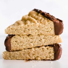 Easy Chocolate Dipped Shortbread Cookies feature a buttery shortbread made with oats and brown sugar dipped in chocolate for the ultimate afternoon treat!