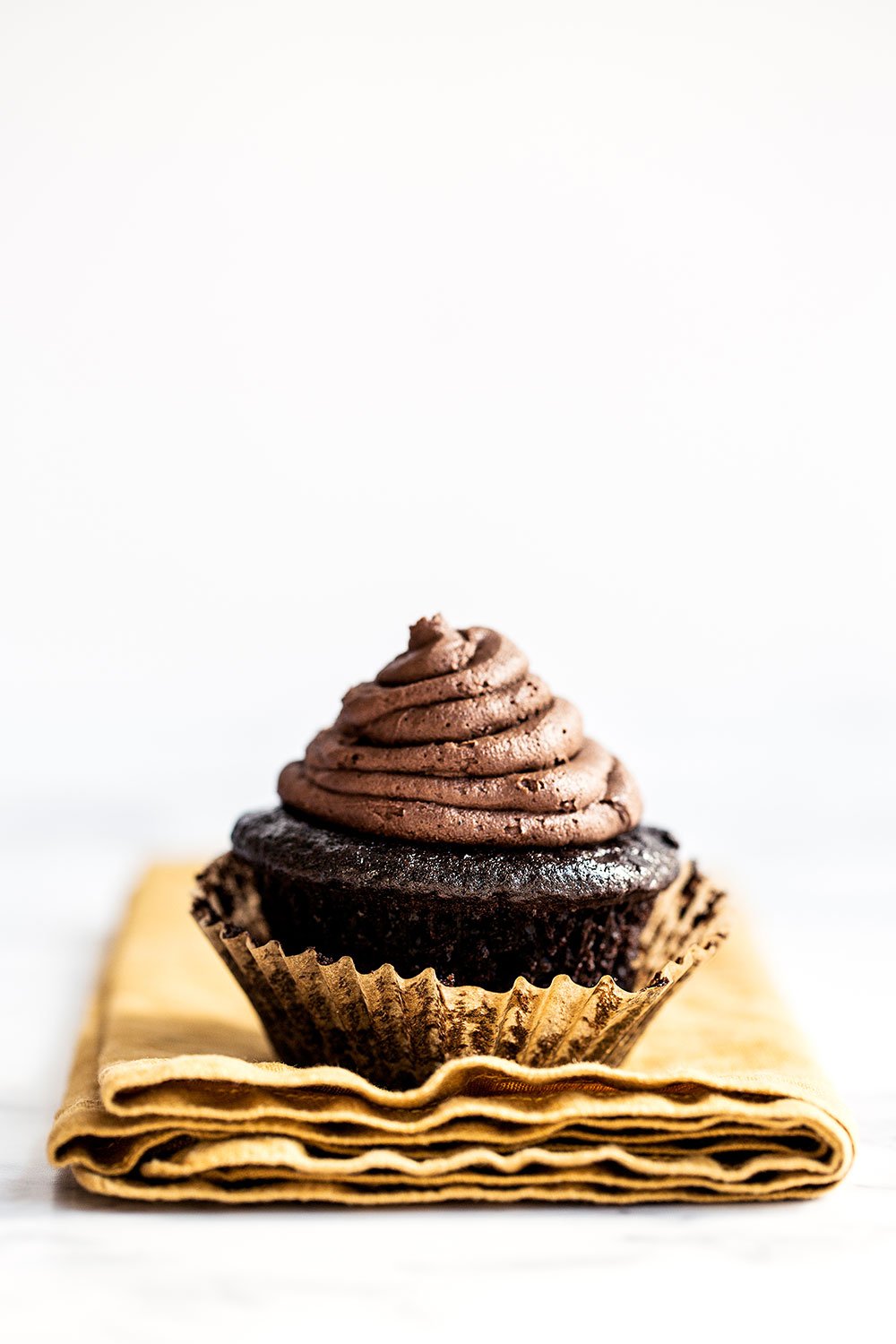 Chocolate Blackout Cupcakes feature a dark chocolate cupcake filled with chocolate ganache and topped with a rich dark chocolate buttercream. For serious chocolate lovers only!!