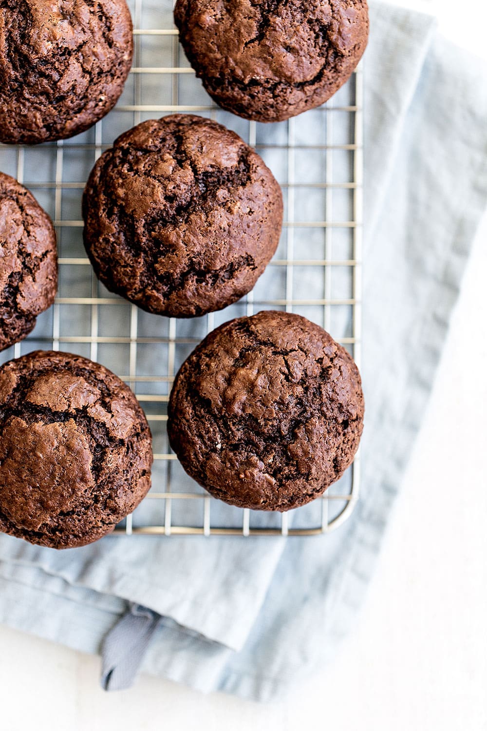 Moist and tender Double Chocolate Muffins feature a brown sugar cocoa muffin studded with gooey chocolate chunks for the ultimate easy treat!