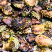 Maple Bacon Brussels Sprouts feature caramelized roasted Brussels sprouts with crispy bits of bacon and a touch of sweetness from the maple syrup. One pan three ingredient recipe!