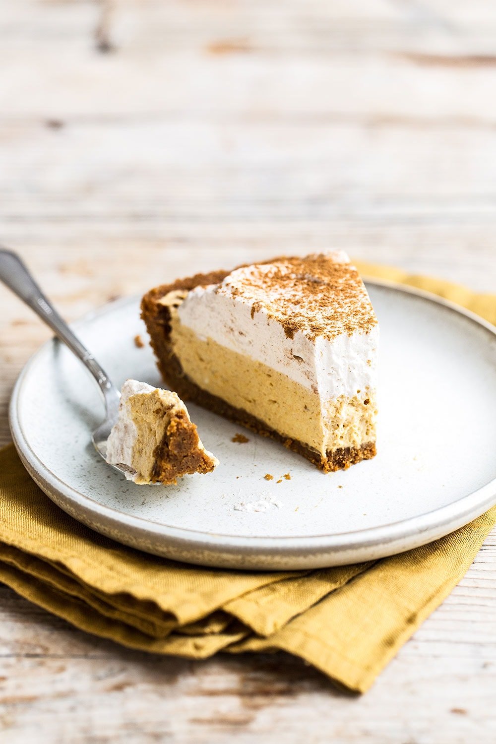 No Bake Pumpkin Mousse Pie features a thick Biscoff cookie crust filled with homemade pumpkin spice mousse and topped with fresh whipped cream. It’s the ultimate easy pumpkin pie for Thanksgiving!