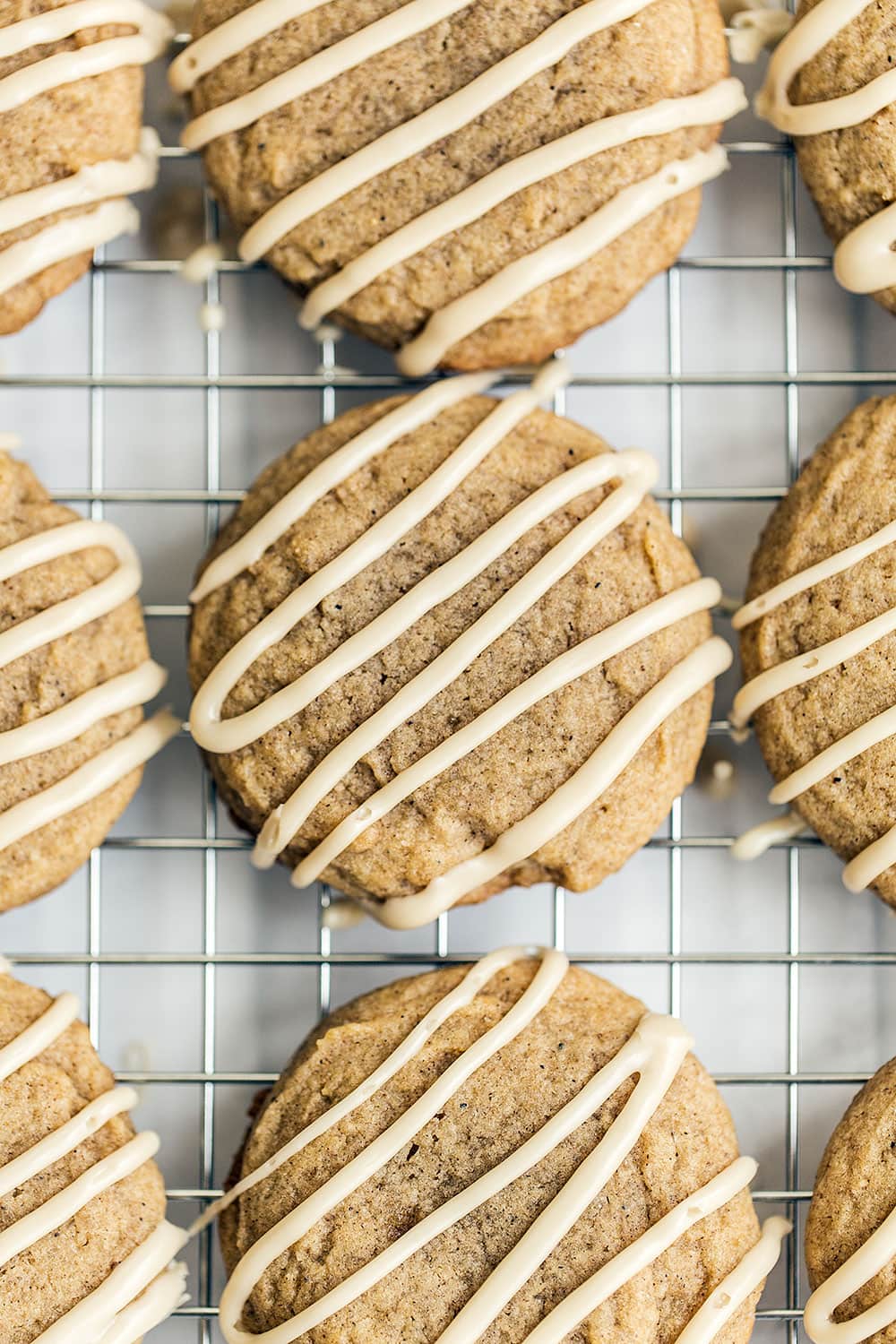 Easy Chai Sugar Cookies are thick, soft, loaded with sweet warm spices, and topped with a simple espresso glaze. Perfect 30 minute recipe for a cozy autumn day!