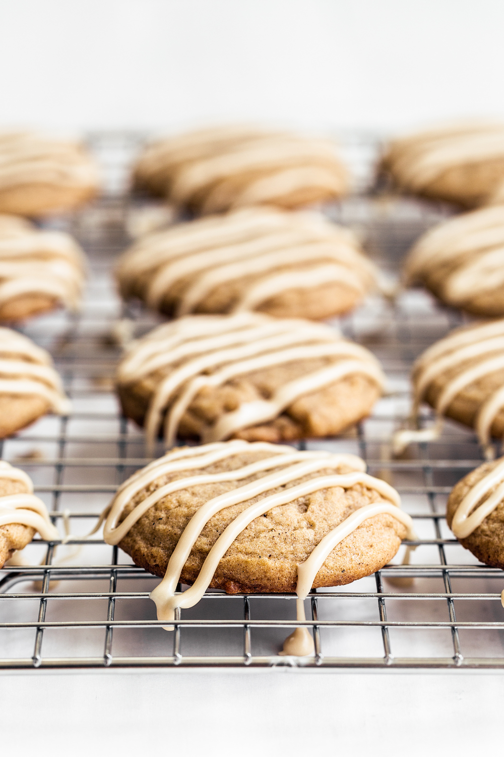 Chai Sugar Cookies on a cooling rack, pictured from the side.