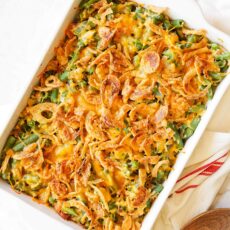 Overhead of cheesy green bean casserole with French's French fried onions on top.