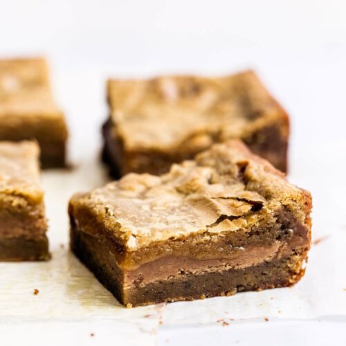 Cookie Butter Stuffed Blondies features a butterscotch brownie filled with gooey fudgy Biscoff cookie butter filling for the ultimate sweet treat!