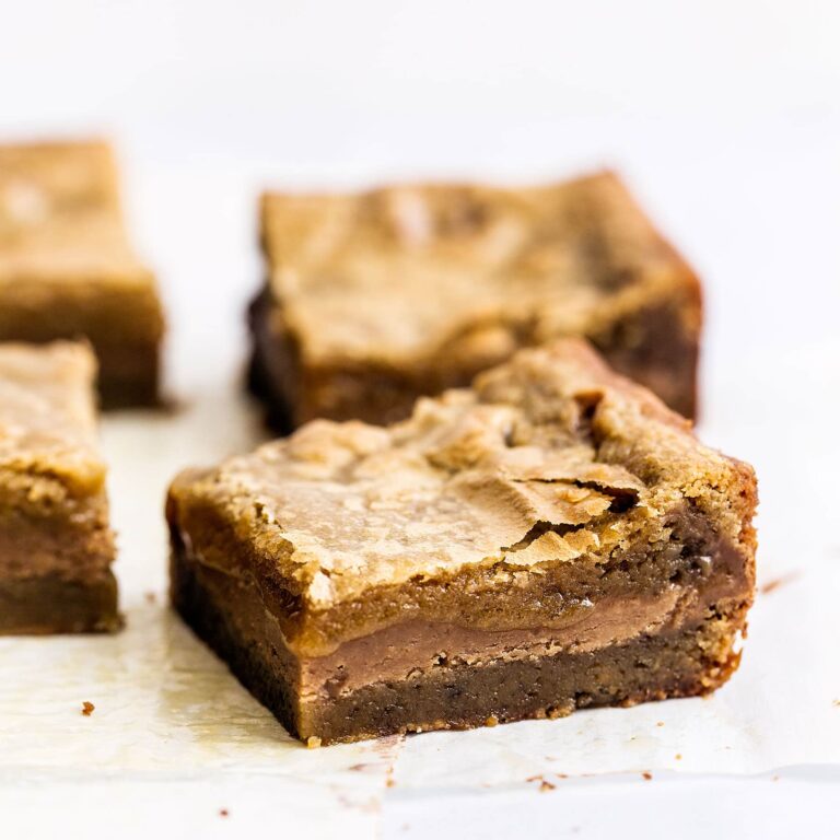 Cookie Butter Stuffed Blondies features a butterscotch brownie filled with gooey fudgy Biscoff cookie butter filling for the ultimate sweet treat!