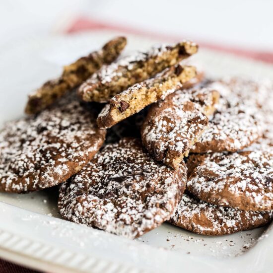 Mocha Cookies are bite-sized soft and chewy espresso chocolate chip cookies coated in cocoa powder and dusted with a snowfall of powdered sugar. A great Christmas cookie recipe!