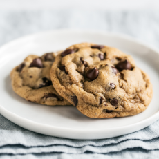 two SOFT chocolate chip cookies on a plate