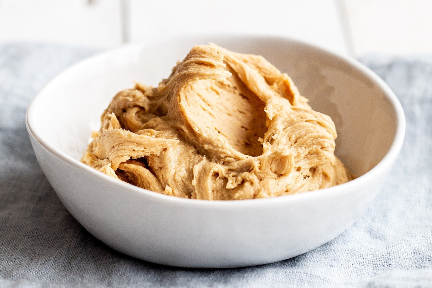 a bowl filled with PB buttercream frosting.