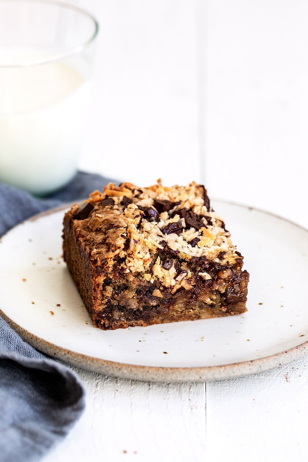 Blondie on a plate with a glass of milk