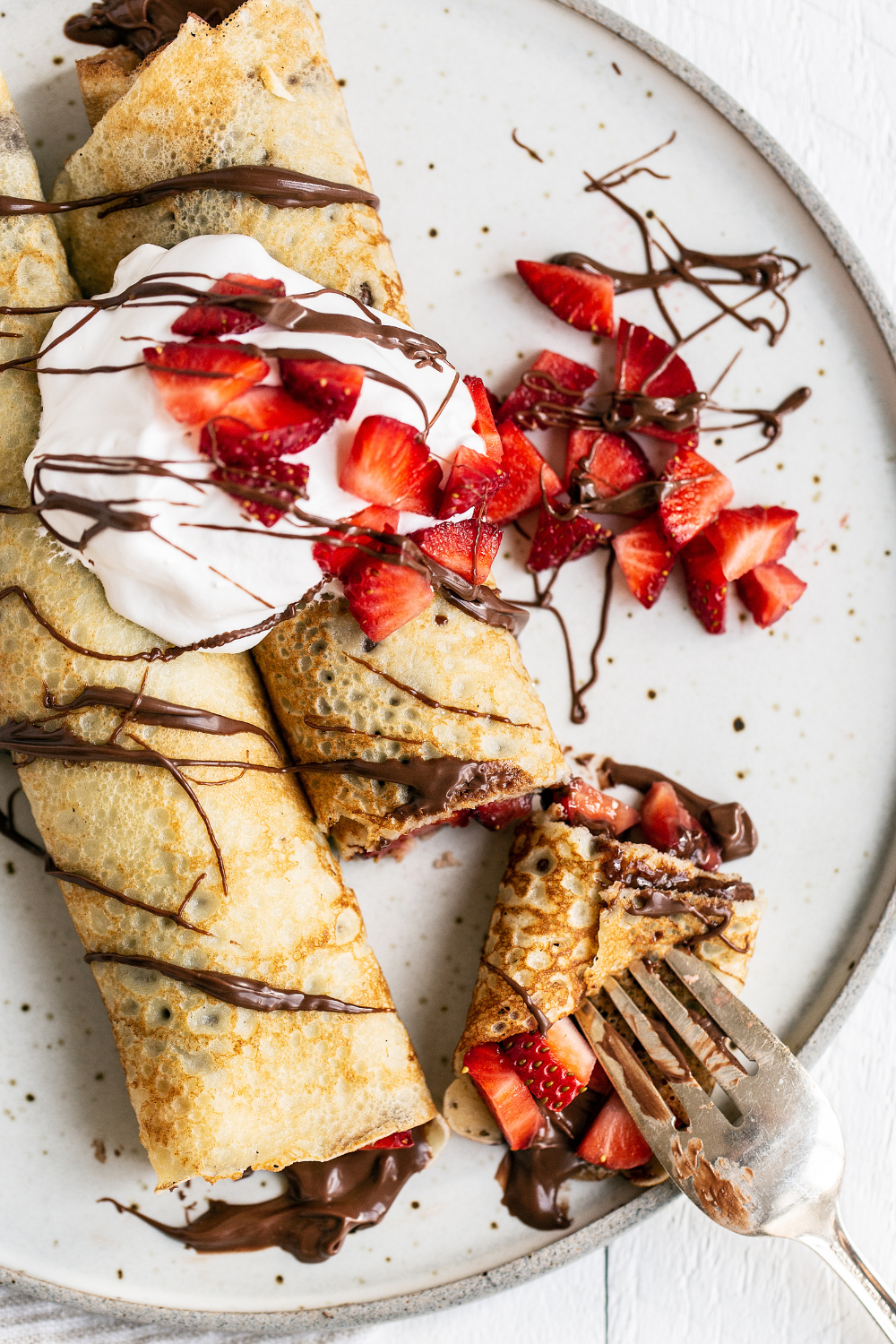 two crepes on a plate, ready to serve.