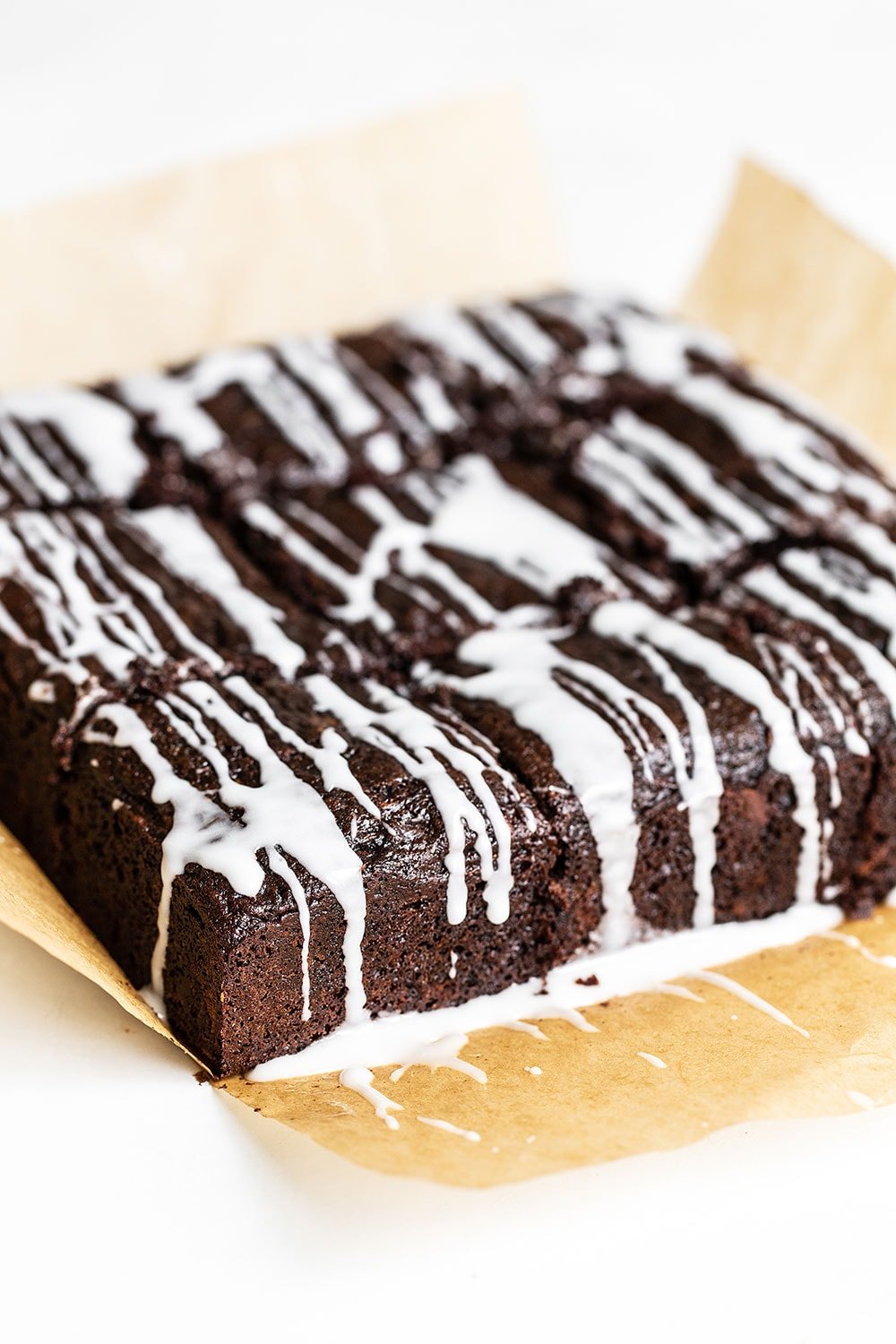 Zucchini Cake with Chocolate and a simple icing on top, sliced and ready to serve for a warm weather potluck